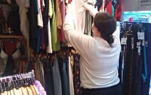 Tegan working in the charity shop
